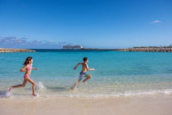 NCL Harvest Caye Children Running Beach Family ©Erin Kunkel.jpg